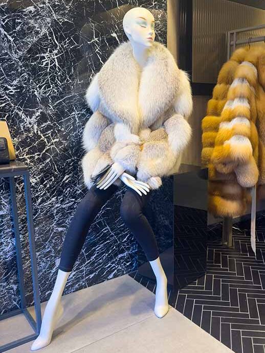 The image features the new 2026 collection at our womens luxury fur boutique in Istanbul showcasing a variety of elite fur varieties. A model is wearing a full-length sable coat from our rare pelt selection which highlights the feminine outerwear silhouettes of the season. The display emphasizes the elegant coat shapes and the detailed artisan fur tailoring that defines our brand. You can see the precision of our master furrier work in the seamless construction of the collar and sleeves. The collection reflects the latest modern glamour trends and a sophisticated contemporary winter style for women. This visual guide helps shoppers visualize the quality available at our womens luxury fur boutique. Each piece demonstrates the beauty of our elite fur varieties and the skill involved in our artisan fur tailoring.